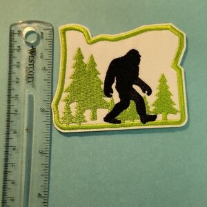 Bigfoot Iron On Patch with Green Trees